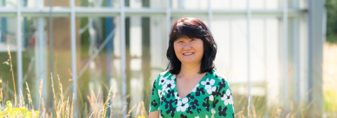 Eiko outside the greenhouses