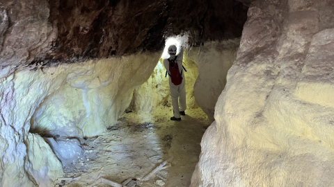 Romanian speleologist Serban Sarbu collects samples in the cave of Stinky Mountain.