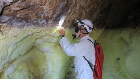 Romanian speleologist Serban Sarbu collects samples in the cave
